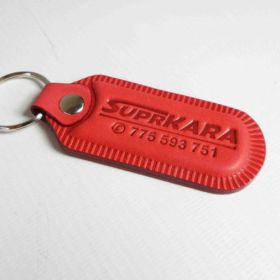 Breloki skrzane i gumowe z logo - referencje - Suprkra