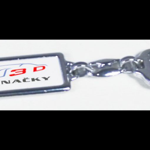 Metalowy brelok z motywem z logo